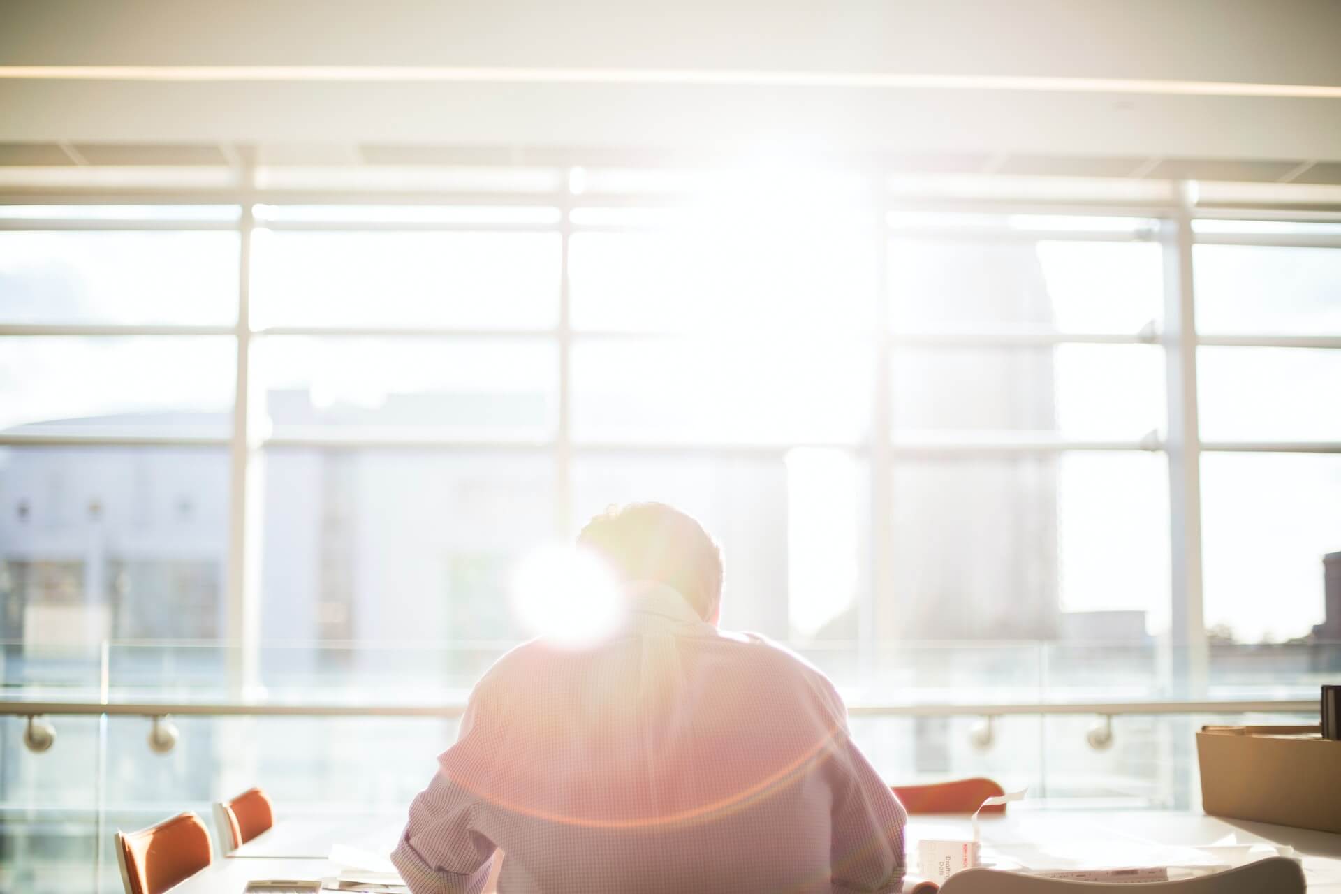 open plan offices worker alone in sunlight